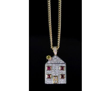 An 18ct gold, ruby and diamond pendant, designed as a house, mounted with four square cut rubies and otherwise pave set with 