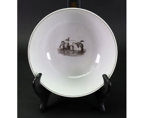 A Worcester porcelain slop bowl, circa 1765, printed in black by Robert Hancock on the exterior with three prints 'The Garlan