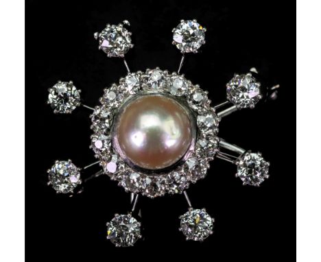 A cultured pearl and diamond star brooch, centred by cultured pearl within a clustered surround of old-cut diamonds, surround