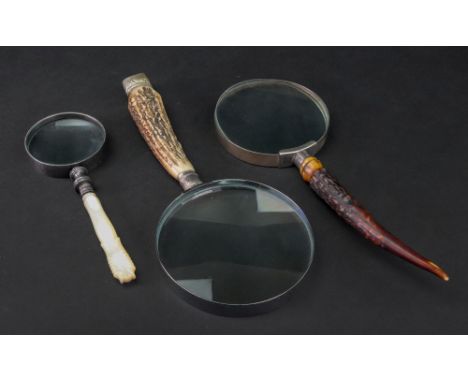 A Victorian silver mounted horn handle, Sheffield 1889, later mounted to a magnifying glass, another Sheffield 1911, and anot