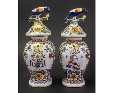 A pair of small Dutch Delft polychrome vases and covers, 19th century, of hexagonal baluster form, one painted with a head an