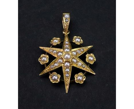 A late Victorian gold and seed pearl pendant, star shape, the points interspaced with flower heads, top bale detailed '18', 3