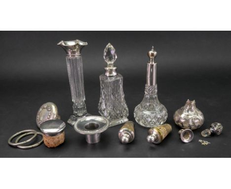 Two silver mounted cut glass perfume bottles, Birmingham 1927 and London 1924, a silver candlestick nozzle and miscellaneous 