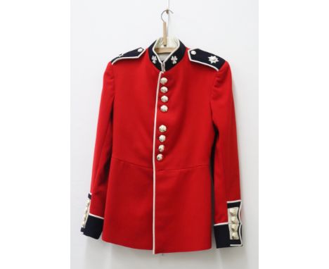 An Irish Guards tunic, R &amp; F 1959 pattern by Kashket &amp; Partners, size 7, Royal Army Pay Corps belt and two berets, a 