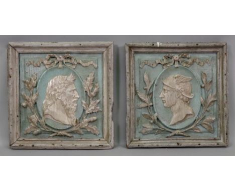 A pair of carved silvered wood and painted rectangular panels, 19th century, the moulded frames enclosing raised and fielded 