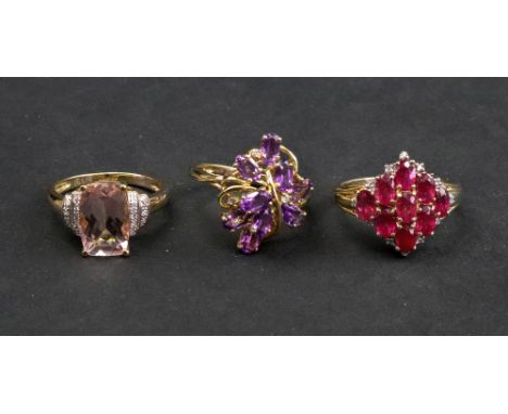 A 9ct gold pink beryl and diamond set ring, the cushion cut beryl claw set between two rows of pavé set diamond shoulders, ri