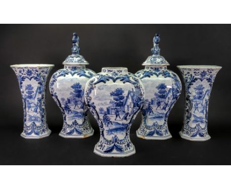A Dutch Delft blue and white five piece garniture, 19th century, comprising; three octagonal baluster vases and coves, one co