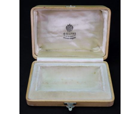 Fabergé; a rectangular hollywood cream silk and velvet lined box, possibly originally for a vodka cup, the hinged cover enclo
