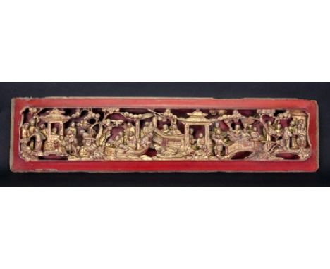 A Chinese painted and gilded wood panel, late 19th century, carved with figures, animals, boats and trees, 64cm long.