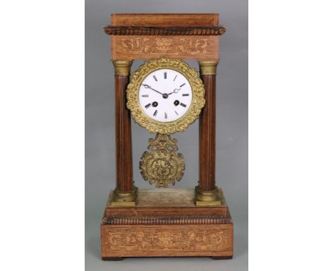 A Charles X rosewood inlaid and gilt metal mounted portico clock, the circular cased movement with enamel dial and Roman nume