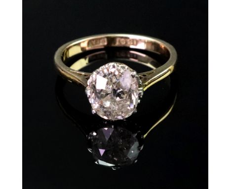 A gold and platinum, diamond set single stone ring, claw set with a large cushion shaped diamond, approx. 2cts, ring size K, 