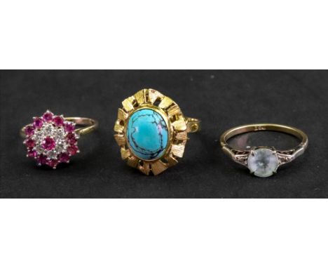 A gold and oval turquoise single stone ring, ring size N, detailed 585, a 9ct gold, ruby and diamond set cluster ring, ring s