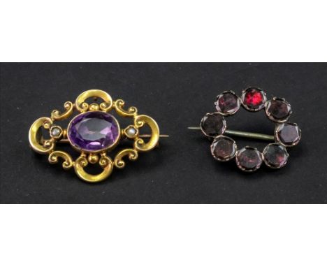 A Georgian circlet brooch, with crimped collet set flat cut garnets, and a 19th century amethyst and seed pearl brooch in 'c'