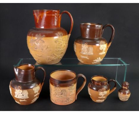 A group of Doulton Lambeth brown stonewares, late 19th/early 20th century, sprigged with various motifs including; windmills,