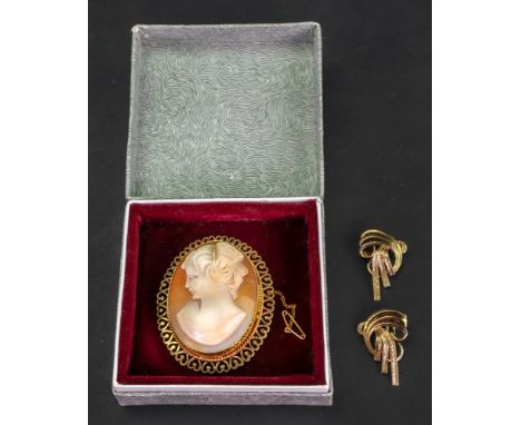 A 9ct gold mounted, oval shell cameo pendant brooch, carved as the portrait of a lady within a pierced heart and ropetwist wi