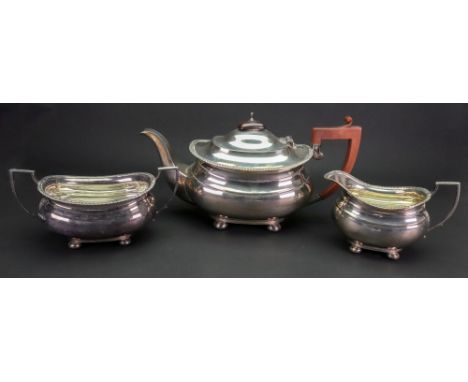 A Regency style silver three piece tea service, Adie Brothers, Birmingham 1941 & 1942, rounded oblong with gadroon borders, o