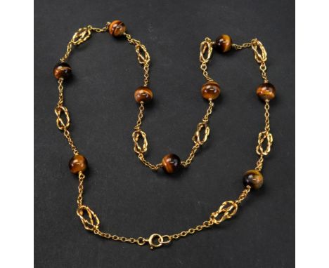 A 9ct gold and tiger's eye bead necklace, the oval link chain spaced with spherical tiger's eye beads, alternating with ribbo