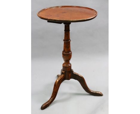 An early George III elm pedestal table, the dished circular top on a vase turned pillar and tripod base, 39cm diameter x 65cm