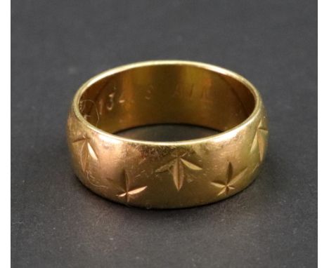 A wide 22ct gold wedding ring, London 1967, with leaf design, ring size Q, 10.6g.