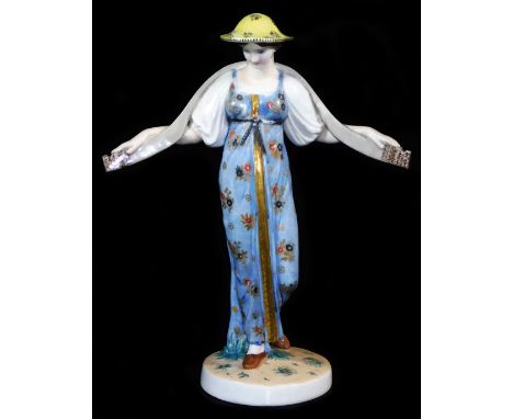 A Russian State porcelain factory figure by S S Pimenov of Vodonoski, shape 1922, polychrome decorated, formed as a lady in f