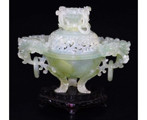 A Chinese green hard stone censer with pierced cover, set with rings and scrolls and flowers, the main body with elaborate fl