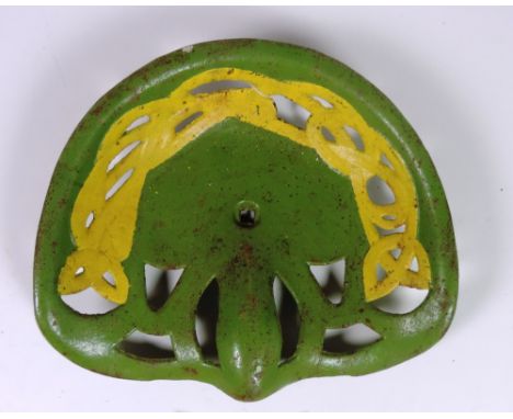 A "Pierce," plain Tractor Seat, in Celtic design painted green and yellow, G.B. 49 6/6, Rate 1. (1)