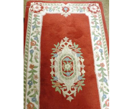 A set of 3 modern Indian Carpet Runners, approx. 305cms (10') long, each with floral borders and three floral centre medallio