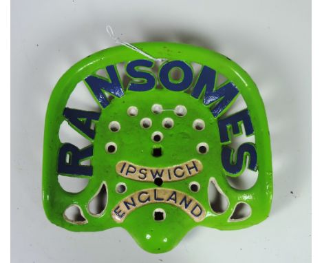 A "Ransomes" Ipswich, England" Tractor Seat, painted lime green and blue, *not in Fr. book, CN 247, letter "W" on reverse. (1