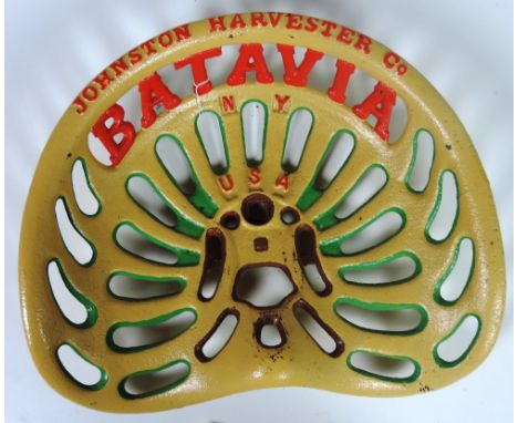 A "Batavia - Johnston Harvester Co., N.Y., U.S.A." Tractor Seat, type 1) painted cream, green and red text FR 80 - R. 5. (1)