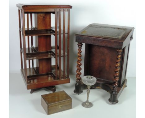 A large early Victorian mahogany Davenport Desk, with barley twist supports, a tall Edwardian walnut Revolving Bookcase, a br