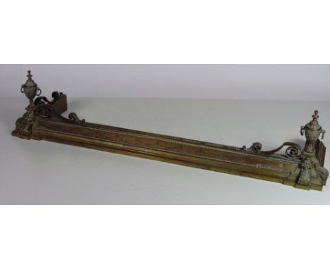 A good heavy engraved brass and copper Fender, decorated in the Adams style with swags, scrolls and two large urns, 165cms (6