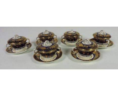 A Hammersley English porcelain Soup Set,  consisting of 6 Soup Bowls, Saucers and covers, with gilt decoration on a dark blue