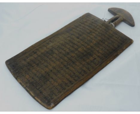 A large inscribed African Islamic wooden Teaching Board, with pierced handle, and with manuscript text from The Quran? 47cms 