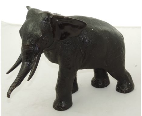 19th Century Japanese School

A very good model of a Young Elephant, with raised trunk, and naturalistic skin, with signature