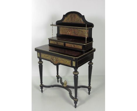 An unusual ormolu mounted 19th Century red boulle Ladies Writing Desk, the arched and shaped shelf back with brass pillar sup