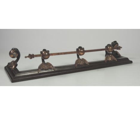 A good quality and unusual 19th Century Gothic Revival polished steel Fender, with copper rail, and balls with painted black 