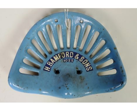 A "H. Bamfords & Son" Tractor Seat, painted sky blue and white (C. No. 1025), G.B. 2.6, Rate 5, FR. 64. (1)