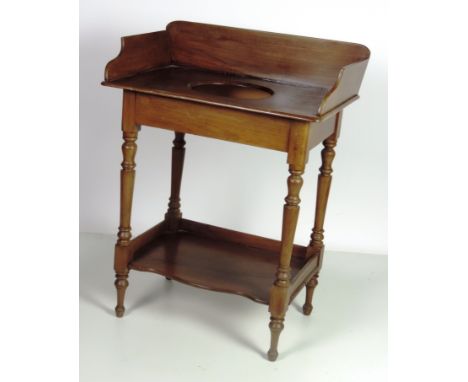 An early Victorian mahogany Washstand, with gallery back, turned uprights and stretcher shelf. (1)