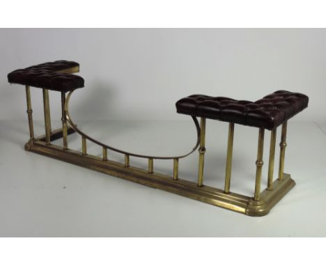 A large brass Club Fender, with centre opening and with deep buttoned leather seats, of recent manufacture. (1)