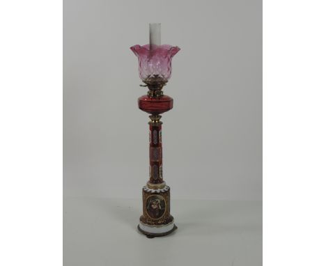 An exceptionally fine tall Victorian overlaid and etched crimson glass Oil Lamp, attractively decorated in gilt and with pane