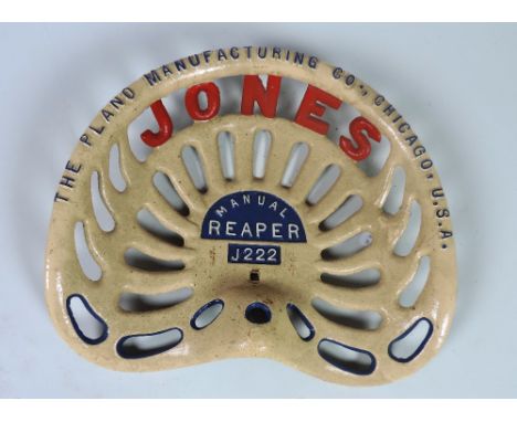 A "Jones," type 1, the Plano Manufacturing Co., Chicago, U.S.A." Manuel Reaper (J222) Tractor Seat, painted cream, blue and r