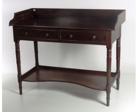 A good early 19th Century Irish mahogany Wash Stand, with shaped gallery back over rectangular top with two frieze drawers, o