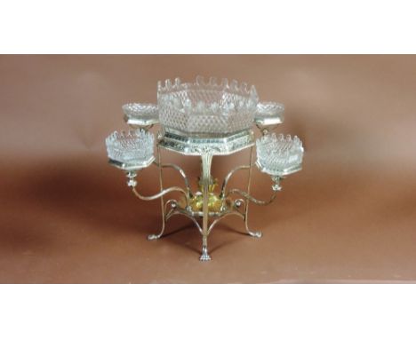 An early 19th Century silver plated Epergne, with large octagonal cutglass centre bowl, on an engraved and gadroon decorated 