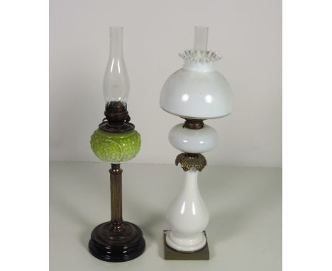 A large milk glass Oil Lamp, with matching body, bowl and shade, on square brass base, 68cms (26 3/4") high; and another Vict