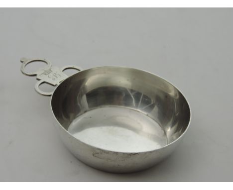 A plain silver Bleeding Bowl, London 1896, by Chas. Stuart Harris, approx. 7 ozs., the three ring handle engd. with coronet &