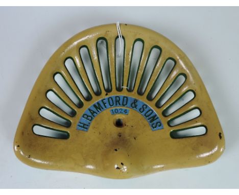 A "H. Bamford & Sons" Tractor Seat, painted cream, green and blue (cast mark 1024) G.B. 2.5, Rate 4, FR 63. (1)