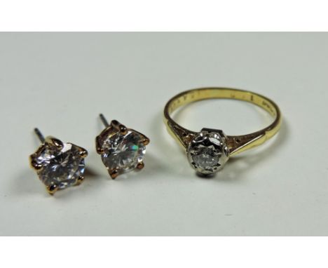 A 9ct gold Solitaire Ring, with clear stone, and a similar pair of Ear Studs, with claw set, clear stone centres. (3)