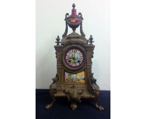 A 19th Century French ormolu Mantle Clock, surmounted with a pink porcelain urn over a circular pink ground porcelain dial de