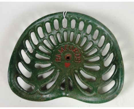 A "Bamfords" Tractor Seat, painted green and red, G.B. 3.3, 3752, Rate 1, FR. 67, 3752 Rate 1. (1)