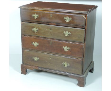 A small Irish Georgian period figured mahogany Chest, with four long drawers each with pierced brass drop handles, bracket fe